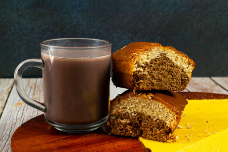 Two pieces of mixed cake and a mug of hot chocolateの写真素材