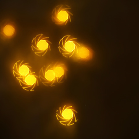 beautiful gold bokeh with pattern of geometric elements on a dark background