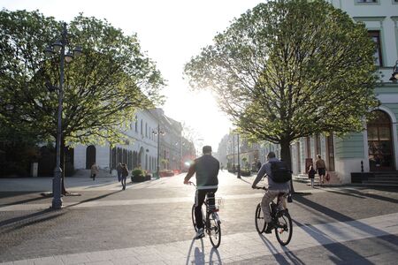 Riding on bicycle in the morning.