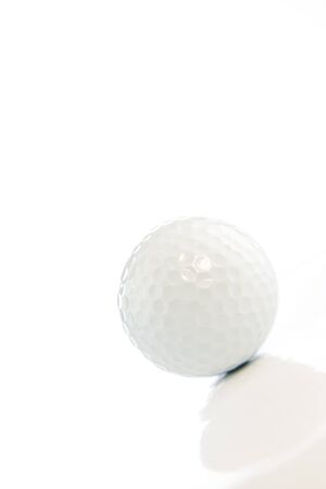 Golf ball on white backgroundの写真素材