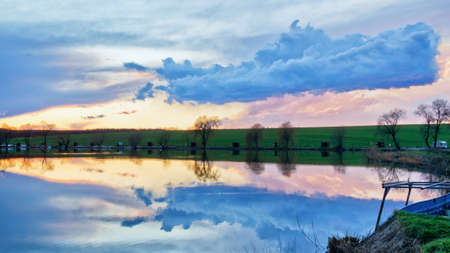 Beautiful cloud in the sunset, over of a lakeの写真素材