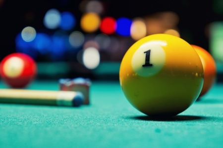 A Vintage style photo from a billiard balls in a pool table  Noise added for a film effectの写真素材