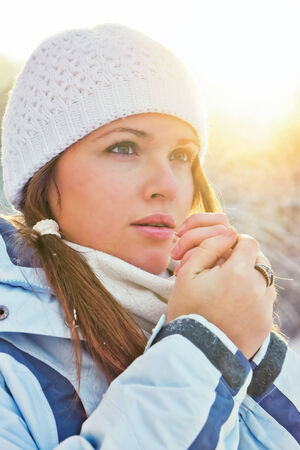 young adult woman are in warm clothes,outdoor in winterの写真素材