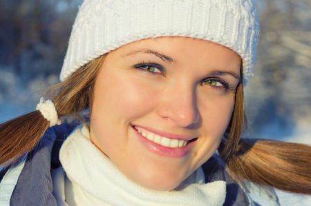 A beautiful young woman in warm clothesの写真素材