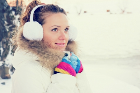 a young girl is cold into the winterの写真素材