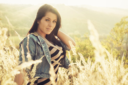 Sunset portait from a beautiful women in autumnの写真素材