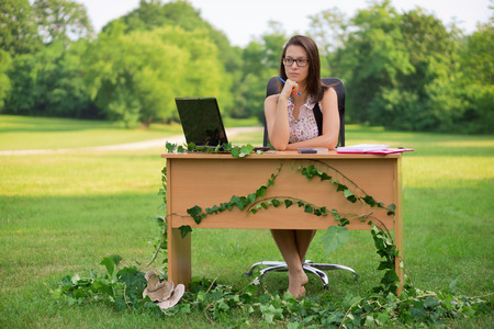 Office in the nature, young secretary working outdoorの写真素材