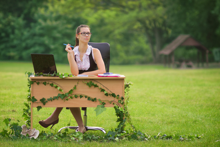 Office in the nature, young secretary working outdoorの写真素材