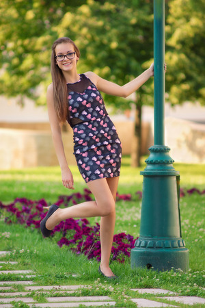 Summer fashion Young girl in the city park at summerの写真素材