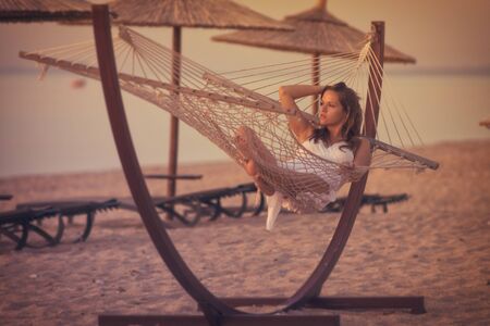Relaxing in a hammockの写真素材