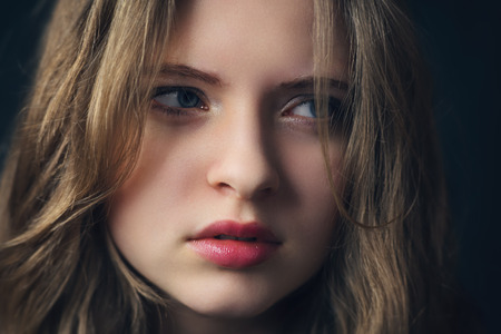 Close up photos from a disappointed, angry young girlの写真素材