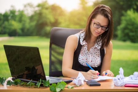 Office in the nature, young business woman working outdoorの写真素材