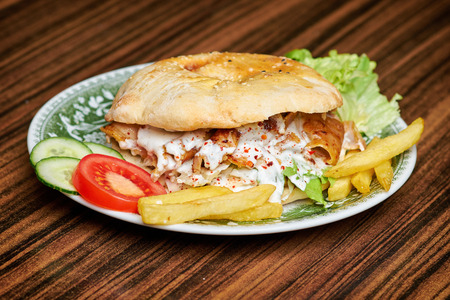 Gyros, greek sandwich wrapped with similar Turkish doner kebabの写真素材