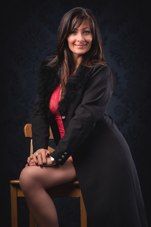 Beautiful middle aged woman in elegant roomの写真素材