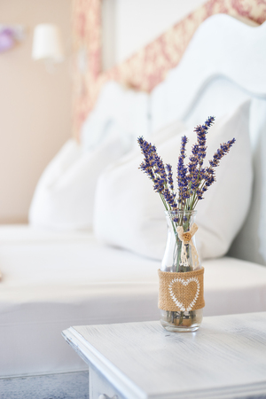 Vintage decor vase in a bright bedroomの写真素材