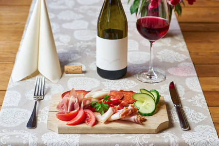 Breakfast with red wine in the backgroundの写真素材