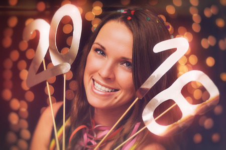 Happy new year / Young woman in a new year partyの写真素材