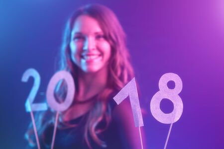 Happy new year / Young woman in a new year partyの写真素材