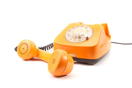 Orange retro telephone isolated on whiteの写真素材