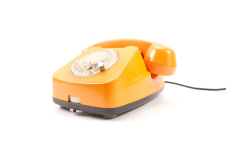 Orange retro telephone isolated on whiteの写真素材