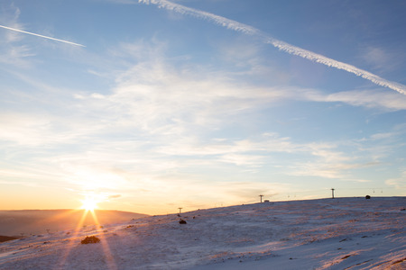 Winter landscape at suntet, on the "Mic" Mountain, in Romaniaの写真素材