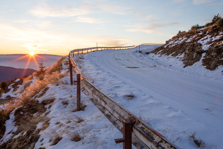 Mountain road, covered in snow, on the "Mic" Mountain, in Romaniaの写真素材