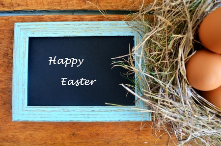 Easter Eggs in a bird nest and a frame.