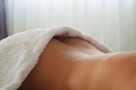 Beautiful relaxed woman in spa salon.の写真素材