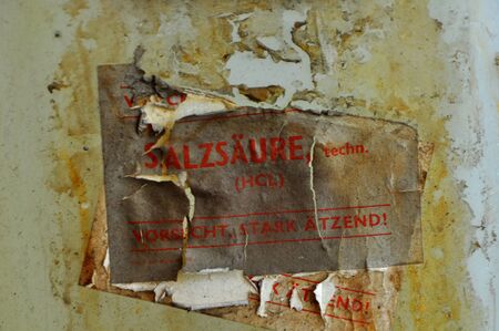 Old hydrochloric acid container with notesの写真素材