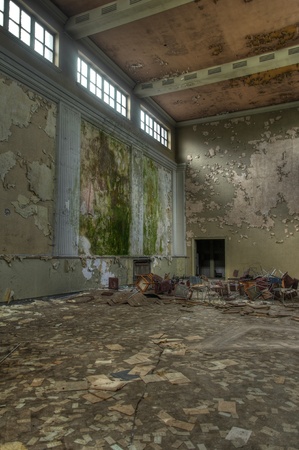 Abandoned large hall with wall-decorationの写真素材