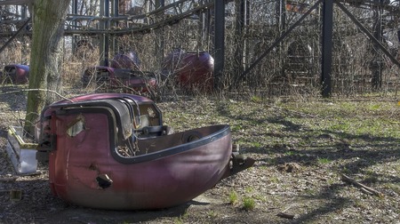 Nacelle of a broken-down old train in an abandoned amusement parkの写真素材