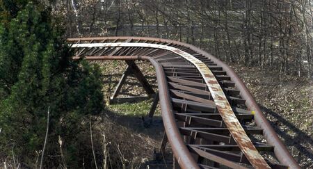 Roller coaster rails in an abandoned amusement parkの写真素材