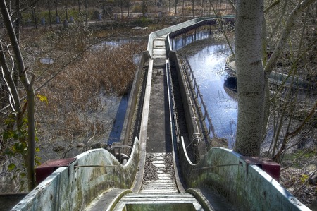 Slide of a flume ride in an abandoned amusement parkの写真素材