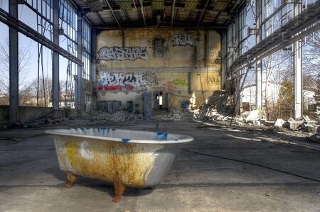 Bathtub in an abandoned warehouseのeditorial素材
