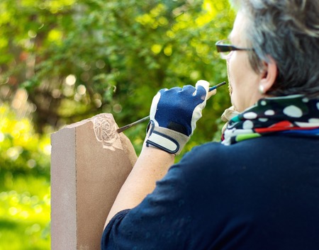 Female stonemason processed a stoneの写真素材