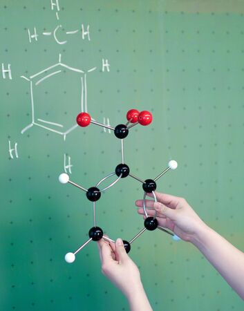 Molecule model in chemistry class and on the boardの写真素材
