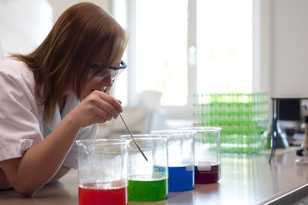 Young woman mixes various experimentsの写真素材