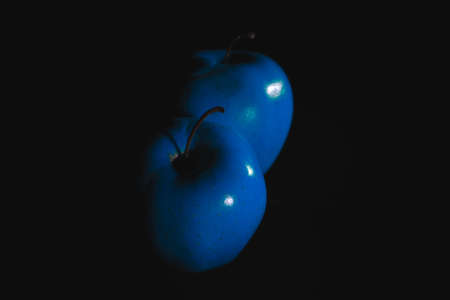 Apple fruit, abstract shadow, black background, blue appleの写真素材
