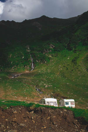Two Caravans, the mountain and a creek in the background, natureの写真素材