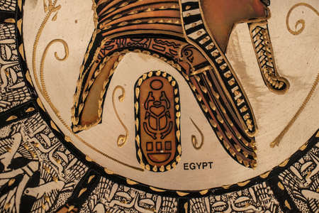 Decor plates on wall, egyptian people, interiorの写真素材