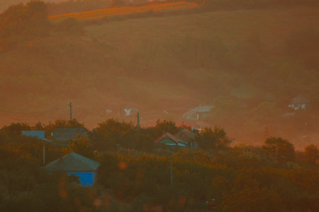 Sunrise landscape, colorful warm cold nature, world, river, hills and village, sunlightの写真素材
