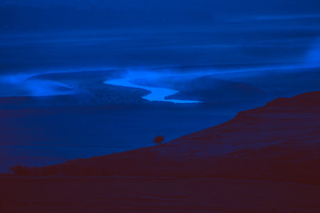 Sunrise landscape, colorful warm cold nature, world, river, hills and village, sunlightの写真素材