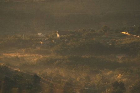 Sunrise landscape, colorful warm cold nature, world, river, hills and village, sunlightの写真素材