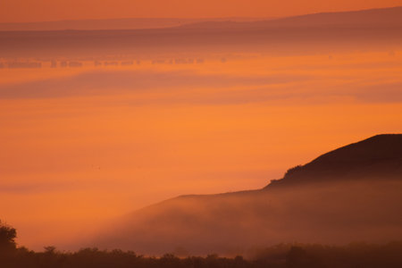 Sunrise landscape, colorful warm cold nature, world, river, hills and village, sunlightの写真素材