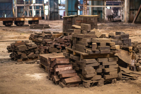 Stack of bricks in a construction site. Industrial background. Selective focus