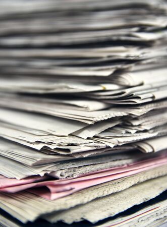 Stacked newspapers close up