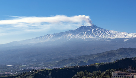 Famous volcano Etna in Sicily releasing cloud of ashの写真素材