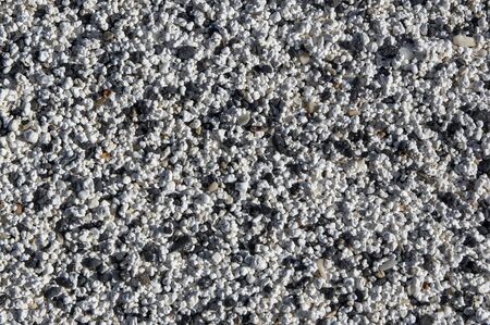 Texture of beach made of rhodoliths. Small bits of rock covered in algae, after breaking up, washed...