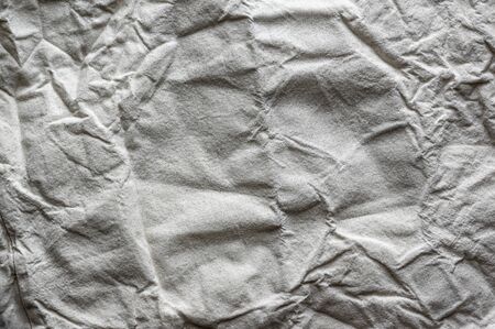Creased fabric texture. Wrinkled cloth backgroundの写真素材