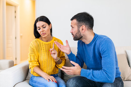 Husband apologizes to wife for treason. Repentant man hope for forgiveness from sad pensive woman....